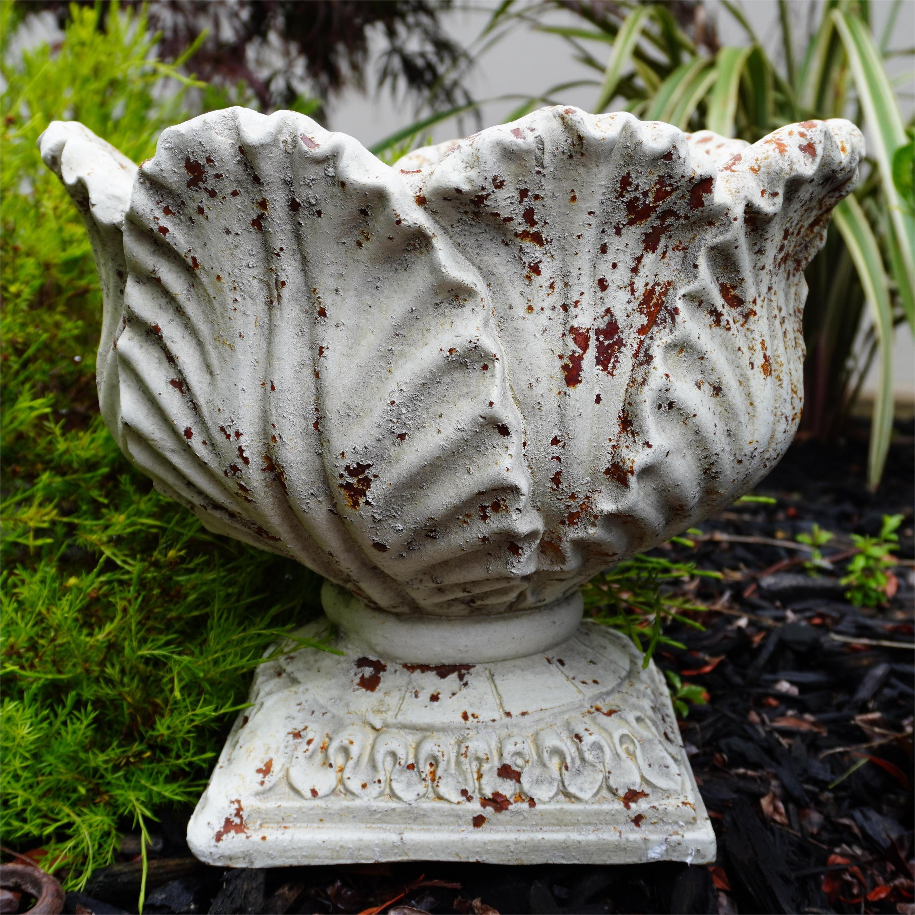 front view of aged leaf urn
