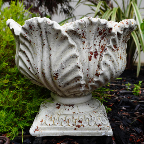 front view of aged leaf urn
