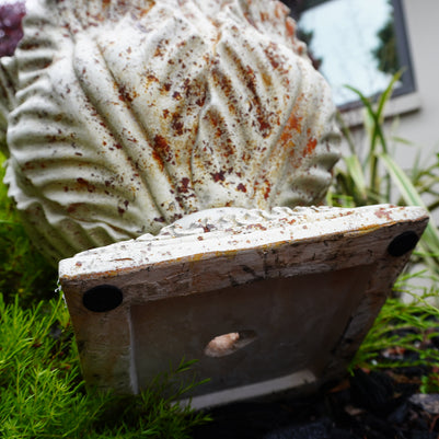 aged leaf urn view from under