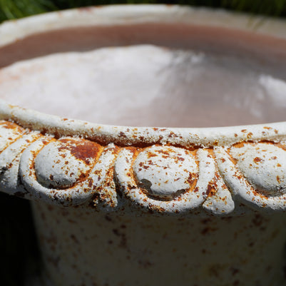 zoomed in Medici Urn showcasing rust