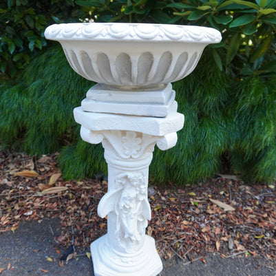 Pot on top of plinth