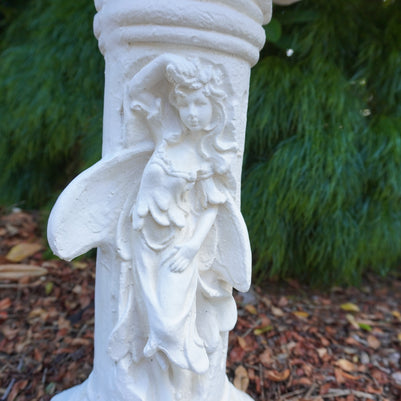 Close up view showing angel on plinth