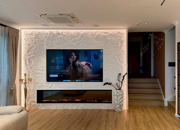 TV wall and fireplace with rock textured finish