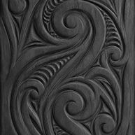 carved maori koru wood panel