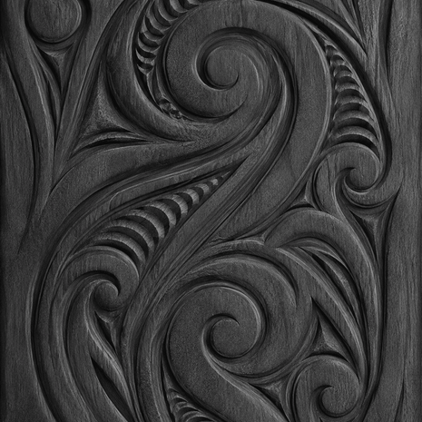 carved maori koru wood panel
